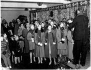 THE 1961 CHRISTMAS CHOIR BEING CONDUCTED BY TOM MA