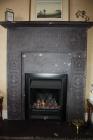 Decorated slate fireplace