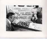  chess competition in the shop window of "...