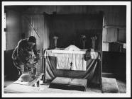 Padre decorating the altar in his 'Church' in...