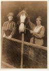 Photograph of two women and horse