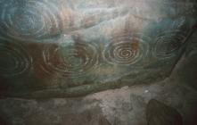 Carved stone inside the chamber of Barclodiad y...