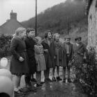 Children singing for a New Years Gift