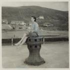 Sitting on a capstan at Aberystwyth Harbour