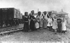 Families of Aberdare miners taking coal from...