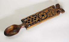 An applewood lovespoon inscribed with the words...