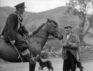 The postman arrives at Cwm Berwyn where his is...