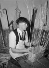 Basket weaver at work at the Welsh Folk Museum,...