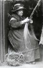 Ellen Williams of Newborough, weaving marram...
