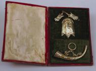 Silver gilt bugle and badges presented to the...