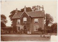 Family group at their house in the country, c....