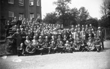 Group photograph of men outside the Metropole...