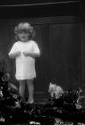 Photograph of a young girl with toy, c.192?-??-...