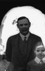 Portrait photograph of father and children, c...