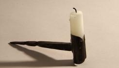 Candle in holder used underground in coal mines...