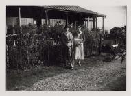 Two lady golfers outside the pavilion at...