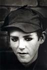 A young miner from Aberfan, his eyes blackened...