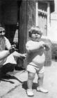 Llangollen. A child outside a house