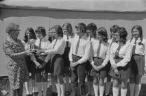 Group of competitors with a cup, National...