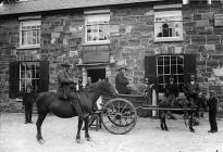 group of musicians outside the Sun Inn,...