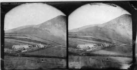 Houses at the foot of a mountain (stereograph)