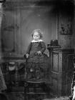 young girl standing on a chair
