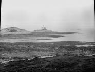 Mumbles lighthouse and sailing boats at...