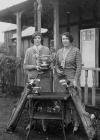 Two lady golfers, one holding the Llandrindod...