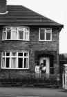 Family on front door step