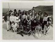 Group of people photographed in costume outdoors