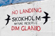 Skokholm island landing sign painted on the jetty
