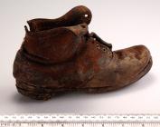 A child's shoe discovered behind a...