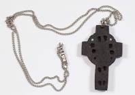 A Celtic cross on silver chain, originally...
