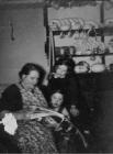 Mother reading to her children, 1930's