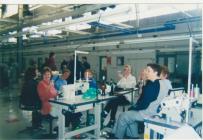 Photo: Workers at their machines on their last...