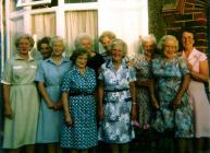 Some women of the church in front  of the manse.