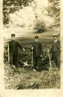 Two policemen and man at Ffarmers, marking the...