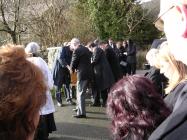 Denzil's coffin is brought into the Church...