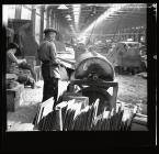 Quarryman operating a slate dressing machine 1960s