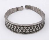 Silver broad-band arm ring 900-925 CE