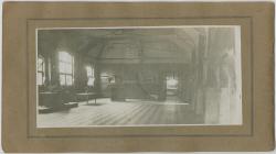 Large Room with Tables and a Piano