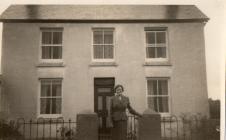 Dora Phillips at gate, Middleton Farm, Llanteg,...