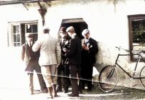 Men and bicycle outside house in Usk, 1902 -...