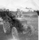 4 Land Army Women on Tractor 