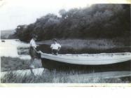 Black and white photograph of two boys playing...