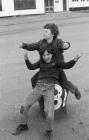 Children Playing on a Mooring Bollard