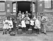 Children with garden vegetables at a 3rd...