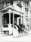 Men on the steps of St George's Hotel,...