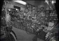 Glass negative: Bike shop interior, Anglesey