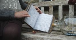 Close-up of a book with handwritten folk...